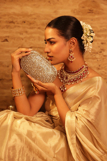 Contemporary crystal-embellished clutches for modern brides Traditional zardozi potlis for classic elegance Trendy fusion pieces that work with Indo-western outfits Timeless designs that never go out of style
