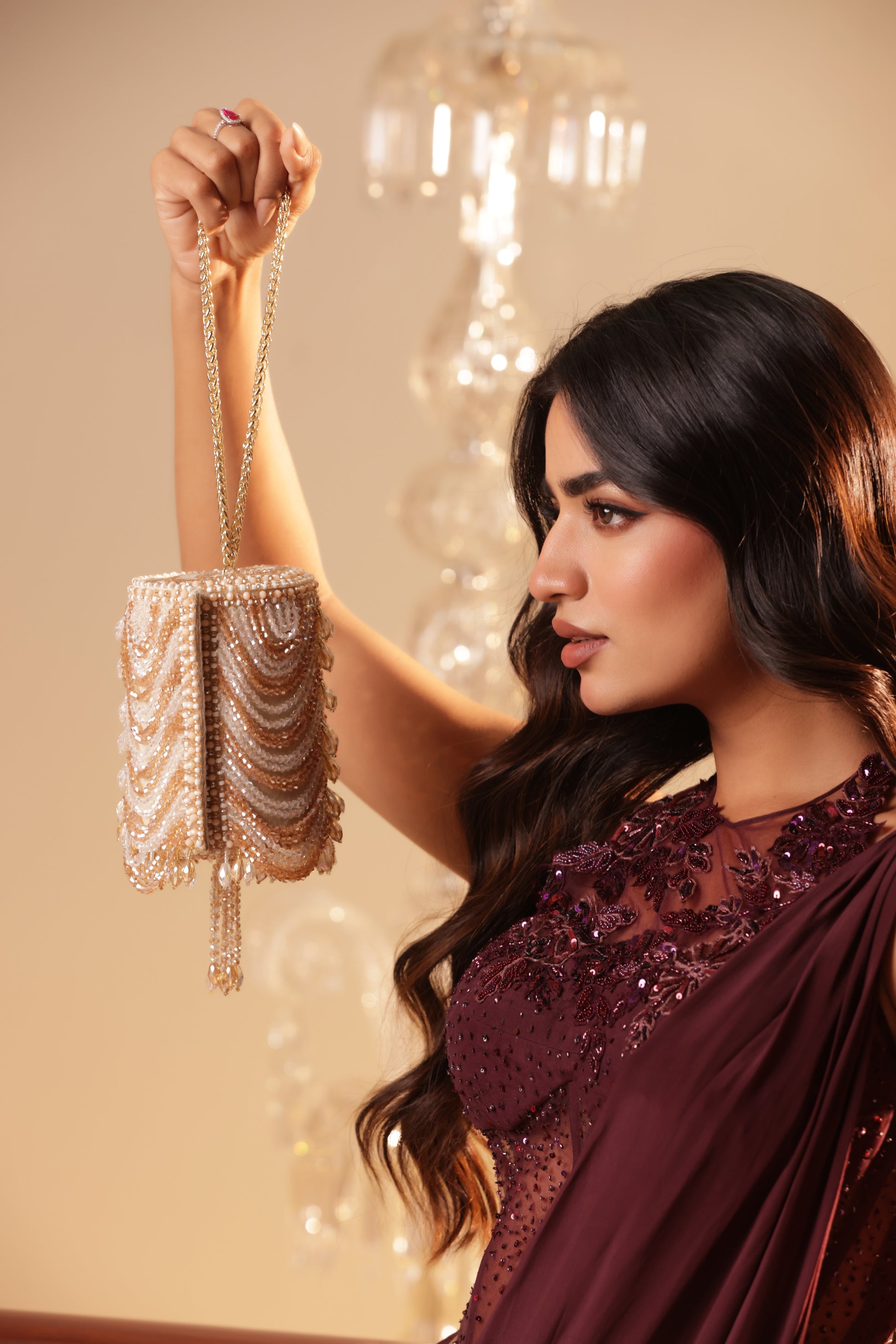 Statement crystal clutch with intricate embroidery and sparkling accents