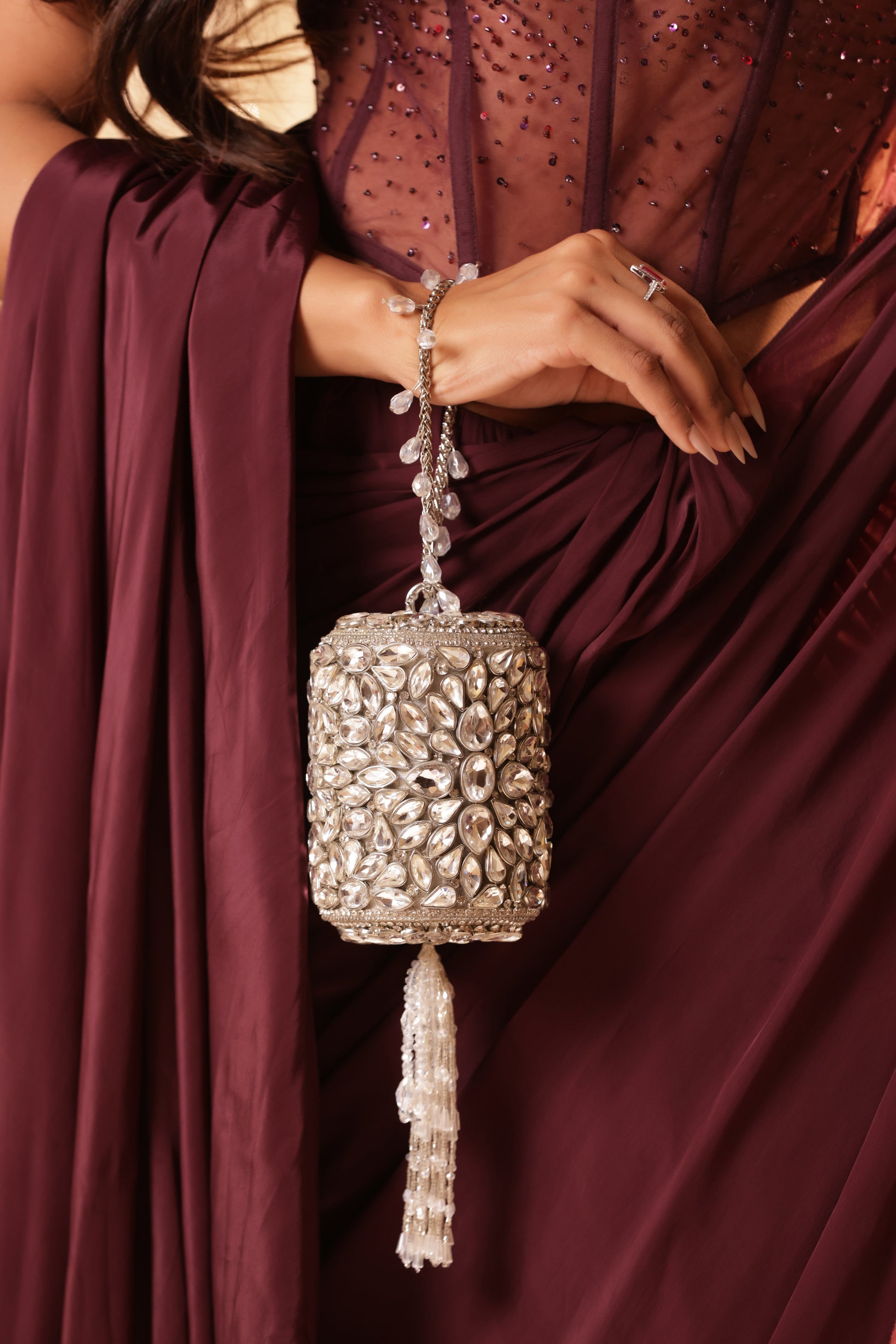 Mini Kundan potli with elegant gold detailing and sparkling stone finish