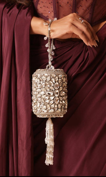 Mini Kundan potli with elegant gold detailing and sparkling stone finish