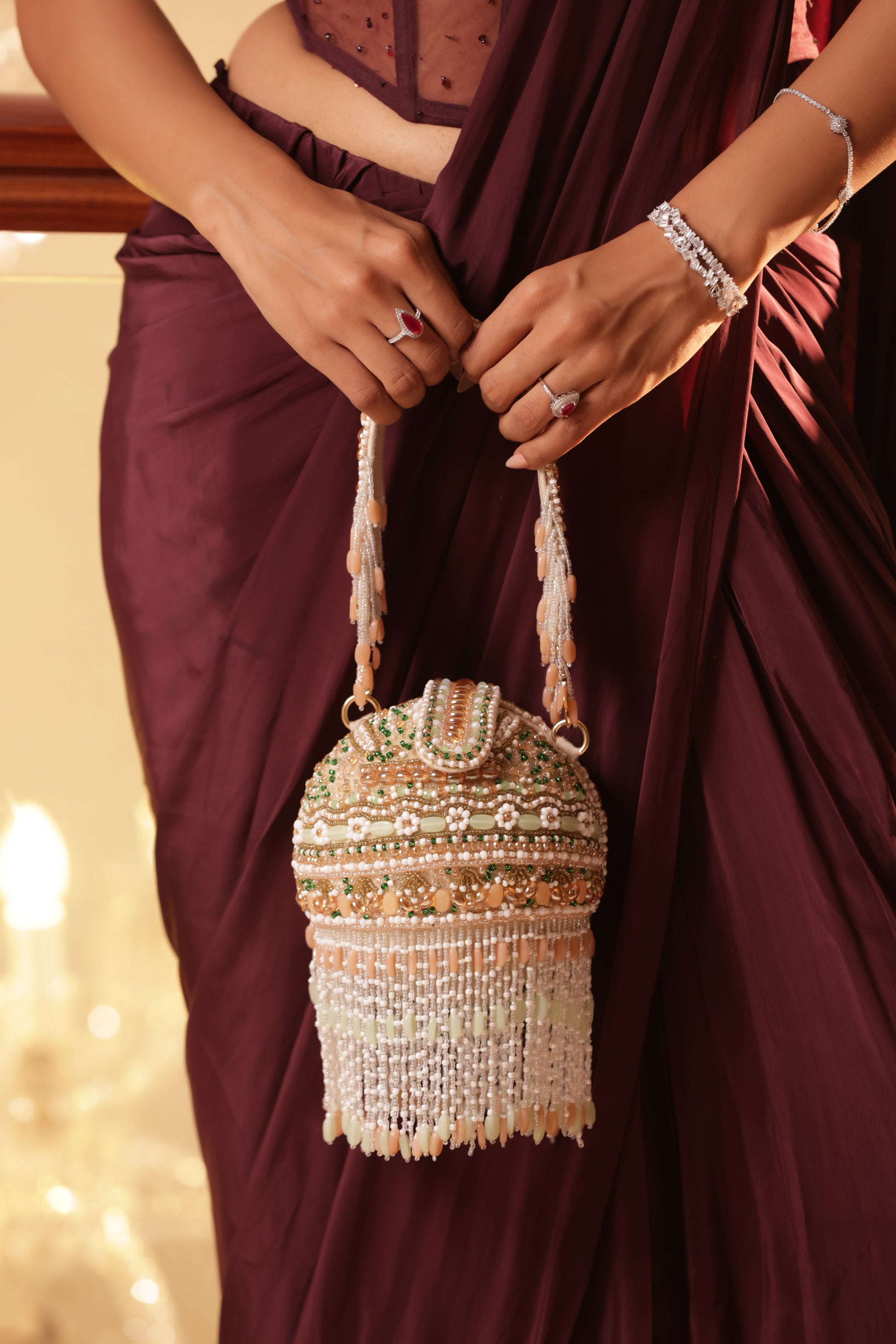 Mini bridal clutch with pearls, crystals, and sculpted crescent silhouette