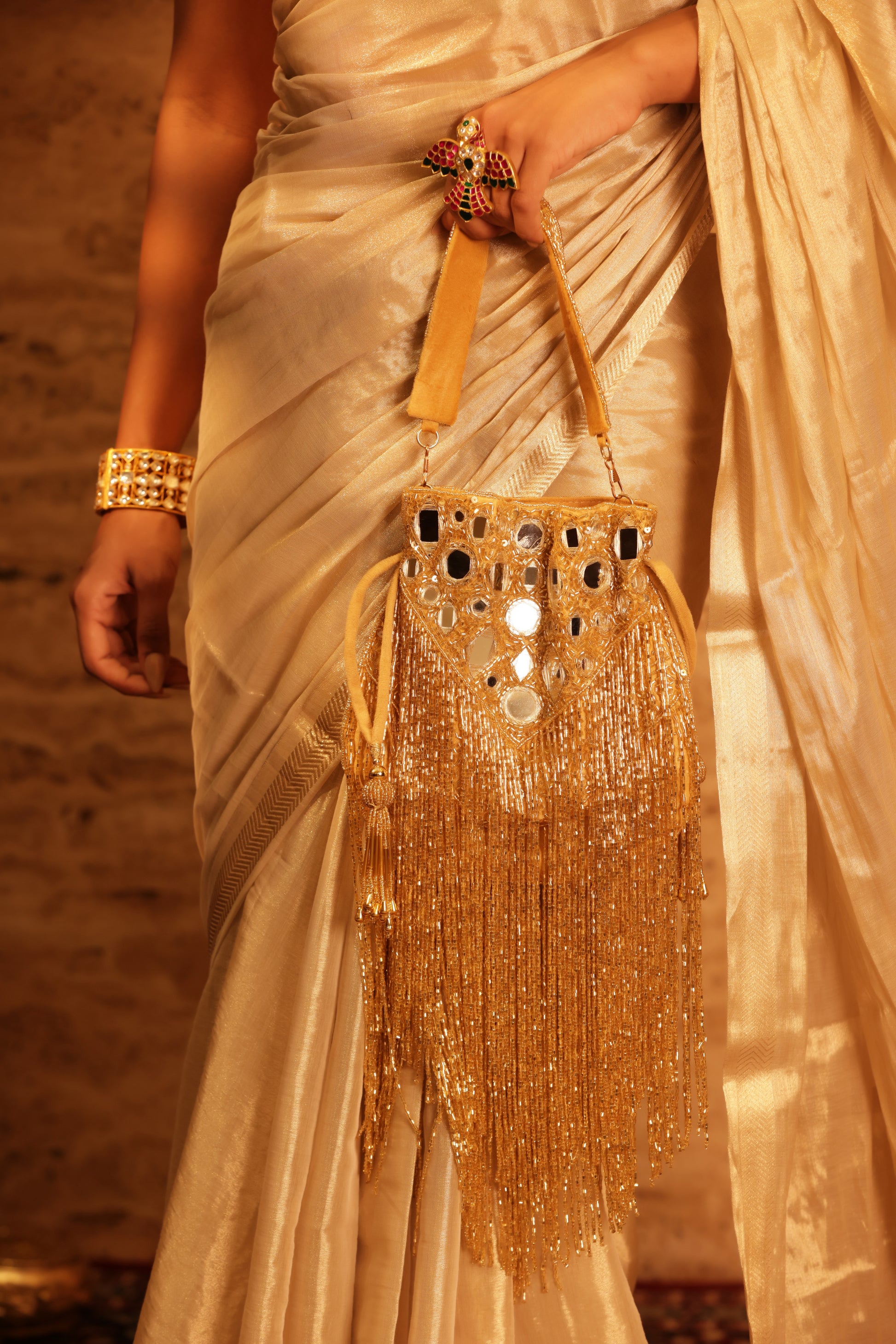 Designer bridal potli with luxurious gold and crystal accents