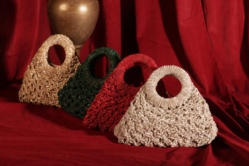 Luxury mesh-work crescent handbags in multiple colors with circular handles, perfect for weddings and festive styling.