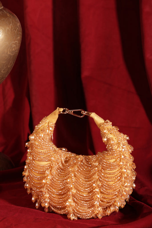 Crystal Charm gold crescent clutch decorated with crystals, perfect for weddings, parties, and festive outfits.