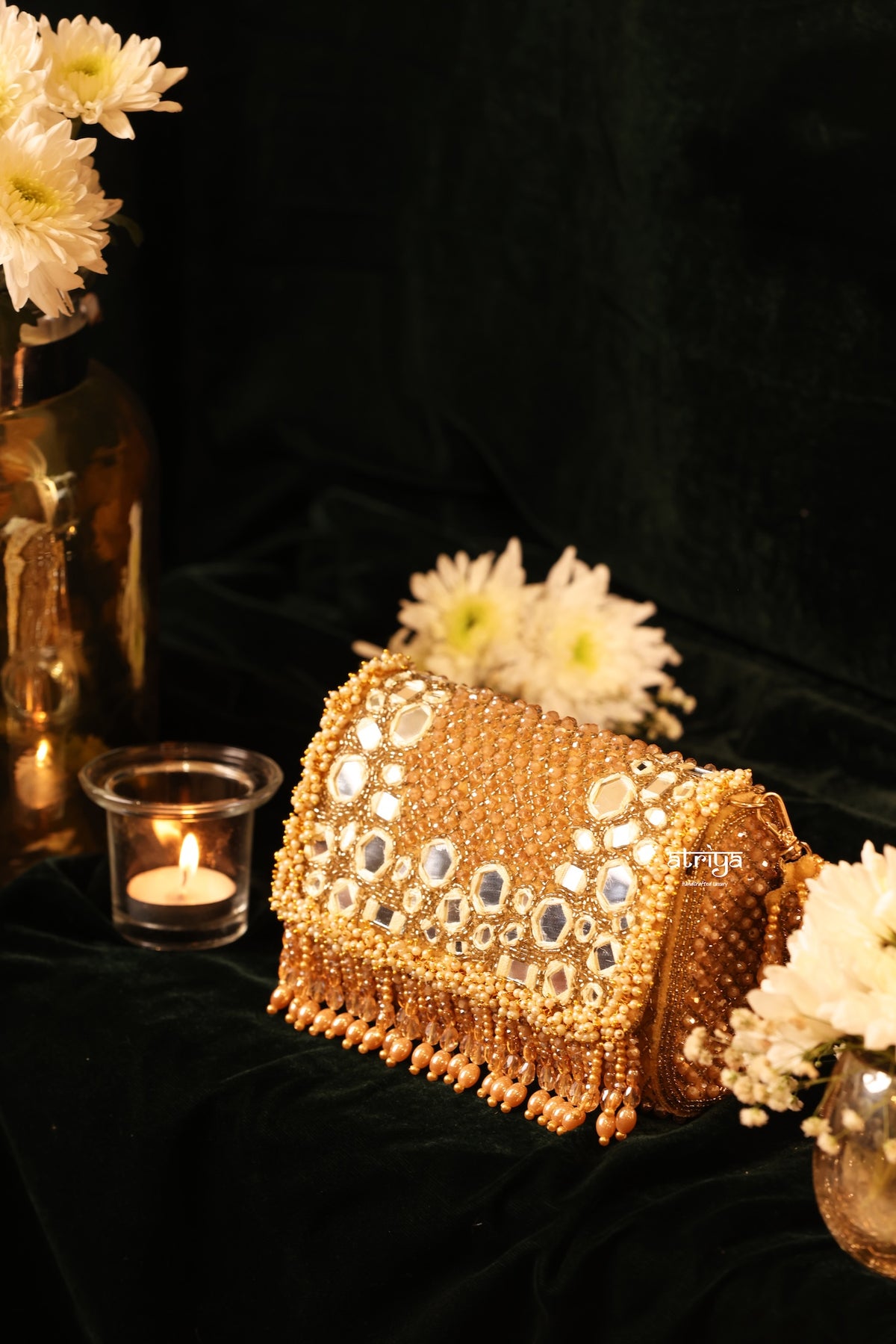 Handcrafted Majestic gold mirror work clutch with fringe detailing by Atriya Jaipur