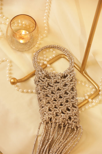 Shimmering silver beaded fringe clutch bag with cascading tassel detail for festive wear