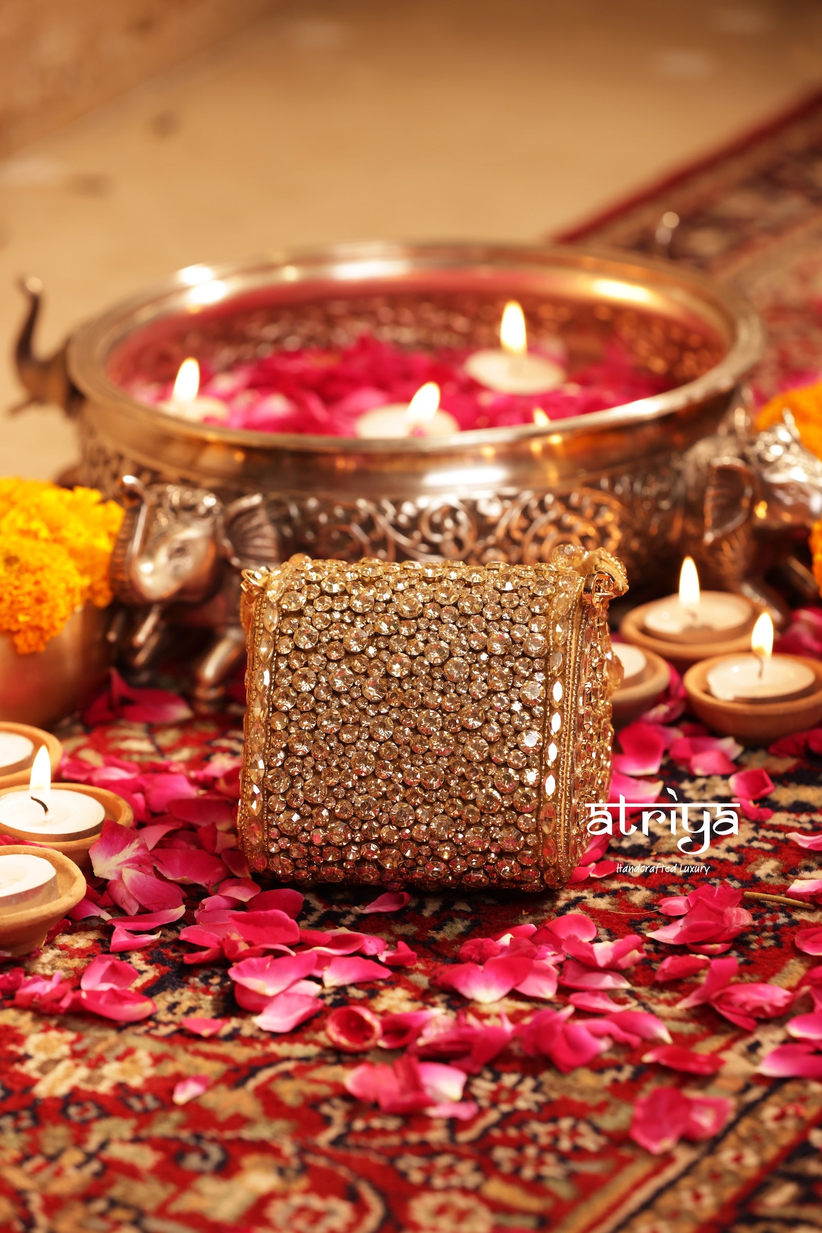 Shop the Goldette Kundan Clutch by Atriya. Handcrafted with dense faceted crystal stones and gold kundan detailing for weddings and festive celebrations.