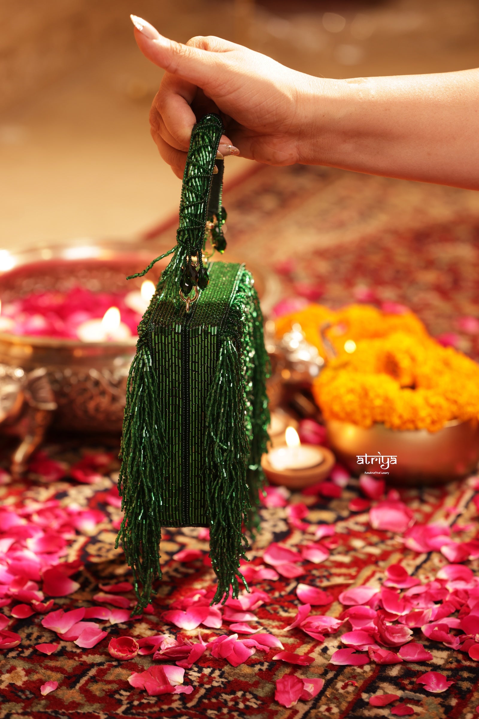 Model holding the Inayat silver crystal clutch with evening festive attire