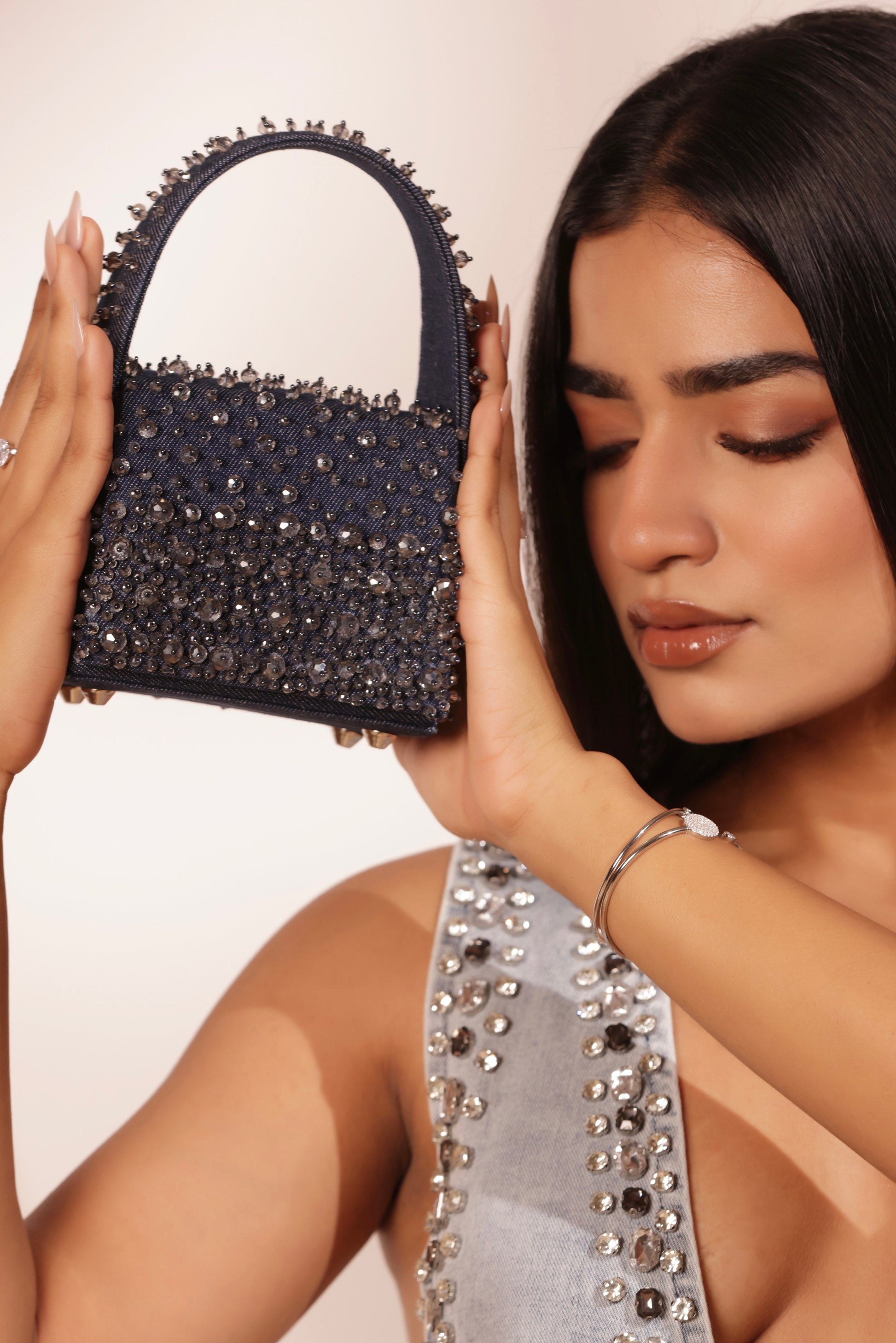 Luxury denim mini clutch with hand-embellished rhinestones for weddings and mehendi