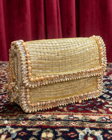 Handcrafted gold evening clutch purse with crystal bead trim and ribbed metallic zari embroidery, luxury bridal handbag
gold evening clutch purse, crystal bead trim, metallic zari embroidery, luxury bridal handbag