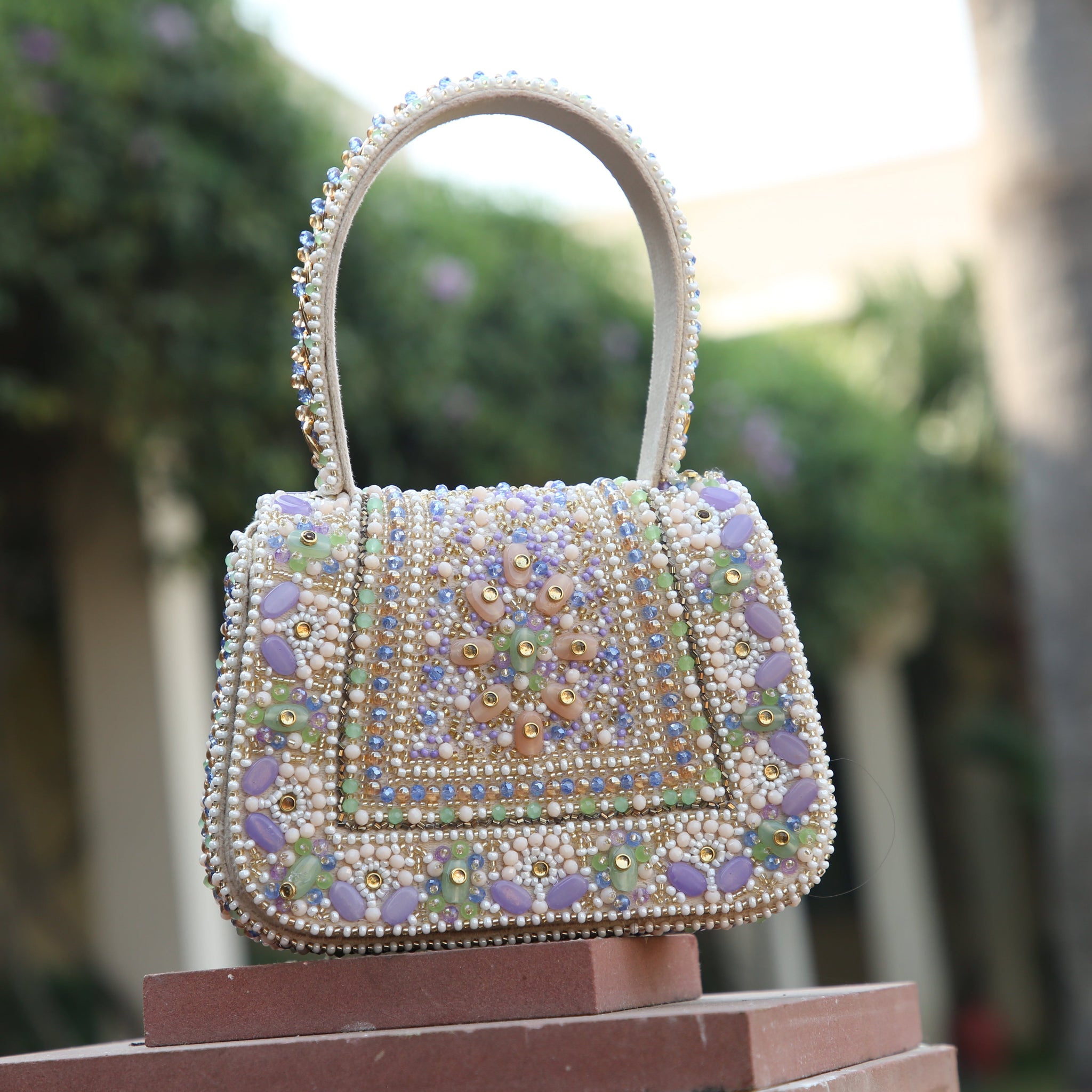 Lavender evening clutch with intricate beads and stones