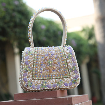 Lavender evening clutch with intricate beads and stones